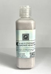Plastic bottle of “Evils Covenant Breaker Head Wash” shampoo with a light blue label, brand logo, usage instructions, and contact details.